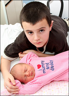 Boy 13 years old with baby